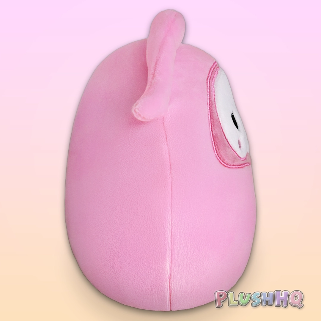 Pink plush toy with a white face on a gradient background, featuring the PlushHQ logo.